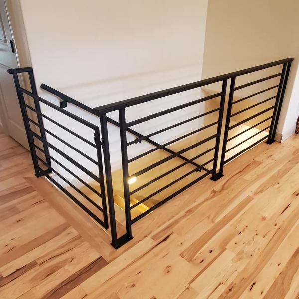 side profile of a horizontal flat black modern railing set 