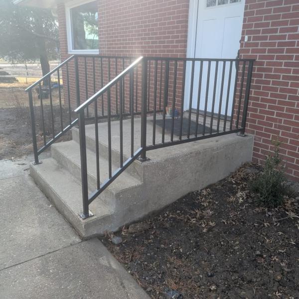 A pair of craftsman railing in the sunlight