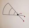 Below view of a modern hanging sculpture.  1/4" round steel is bent to look similar to a wing or fan on one side of this sculpture while 3 red steel slugs counter balance the other side.  Painted black round and painted red steel slugs.