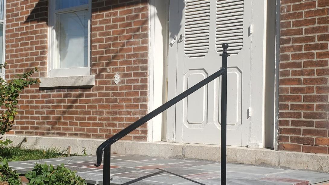 4 foot recreated historical black powder coated railing with a lamb's tongue and decorative ball cap on top.