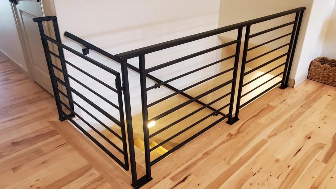 side profile of a horizontal flat black modern railing set 